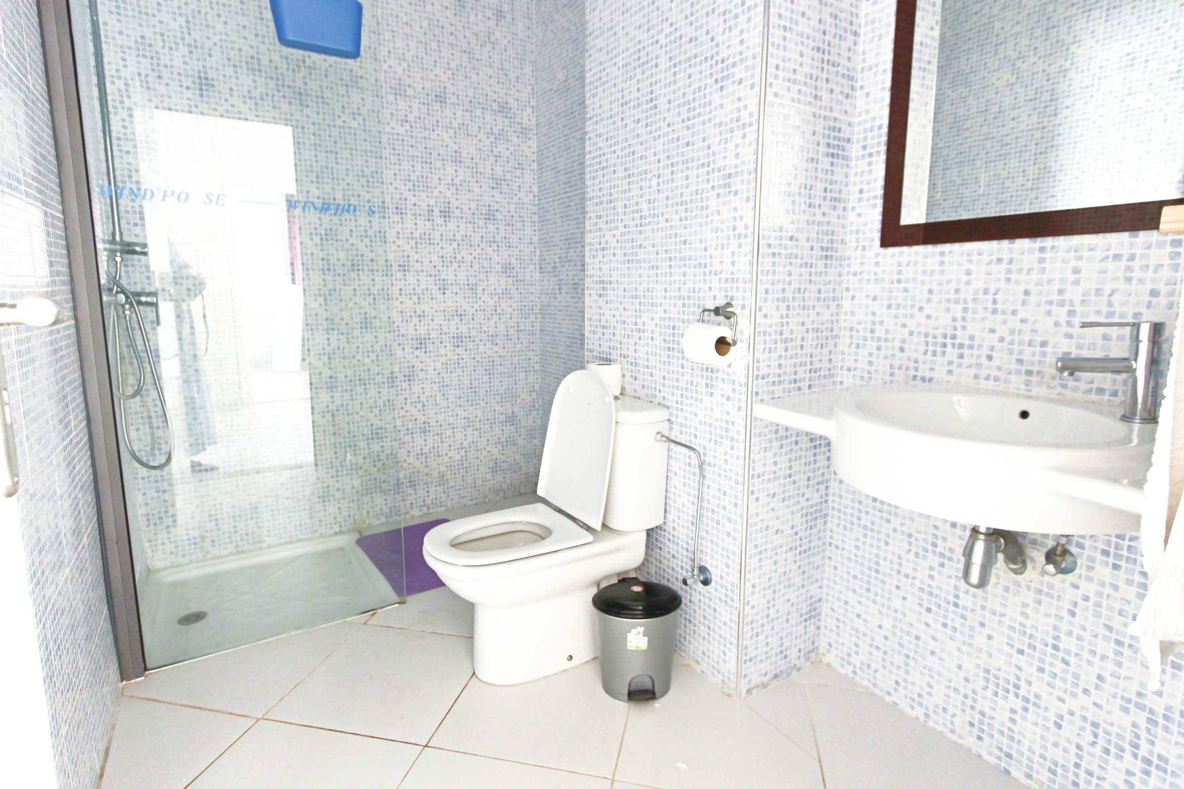 Bathroom with mosaic tiles and a walk-in shower