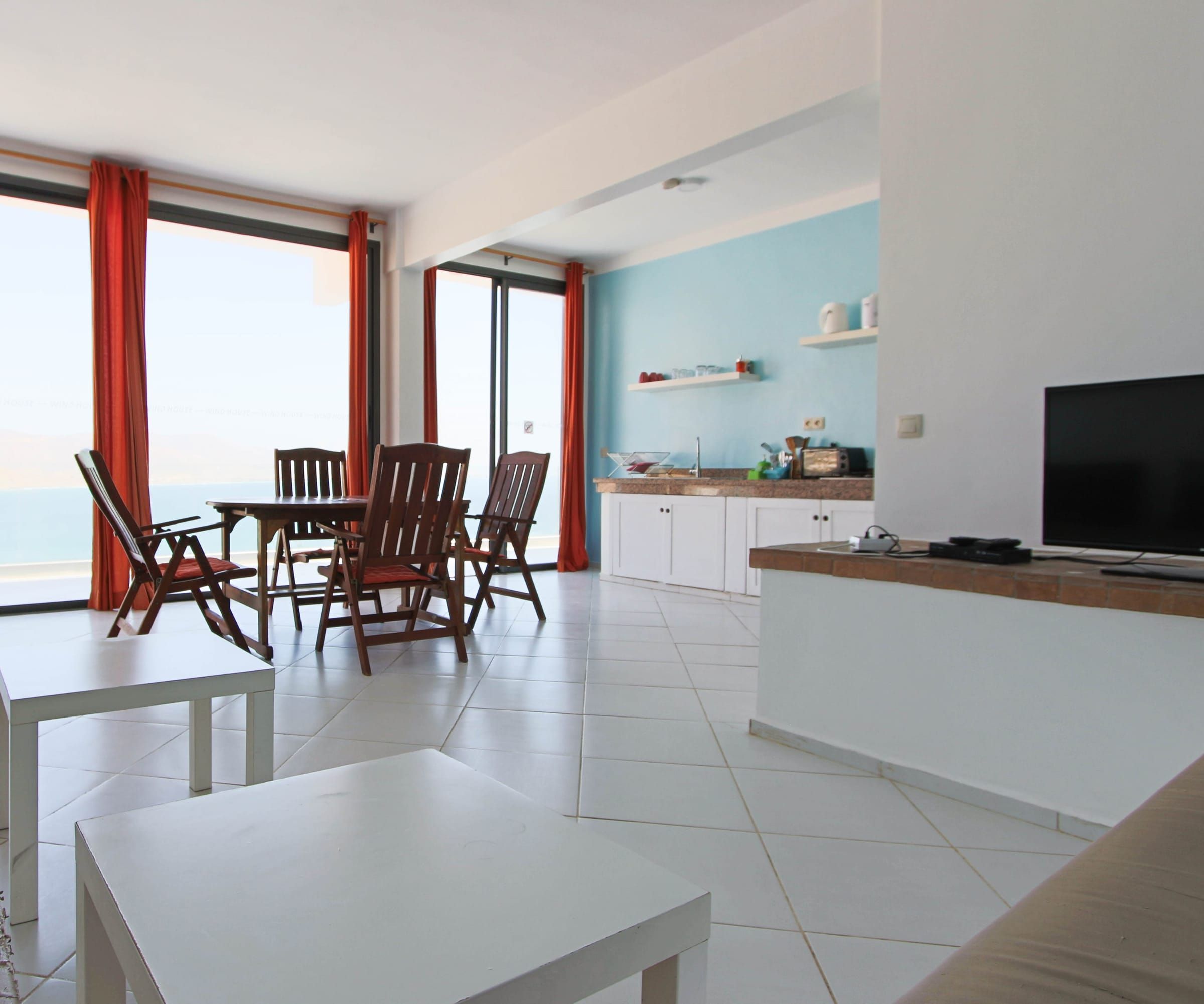 Living room and kitchen with a sea view